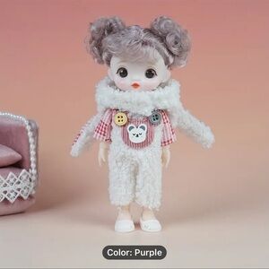 Adorable Doll with Purple Outfit